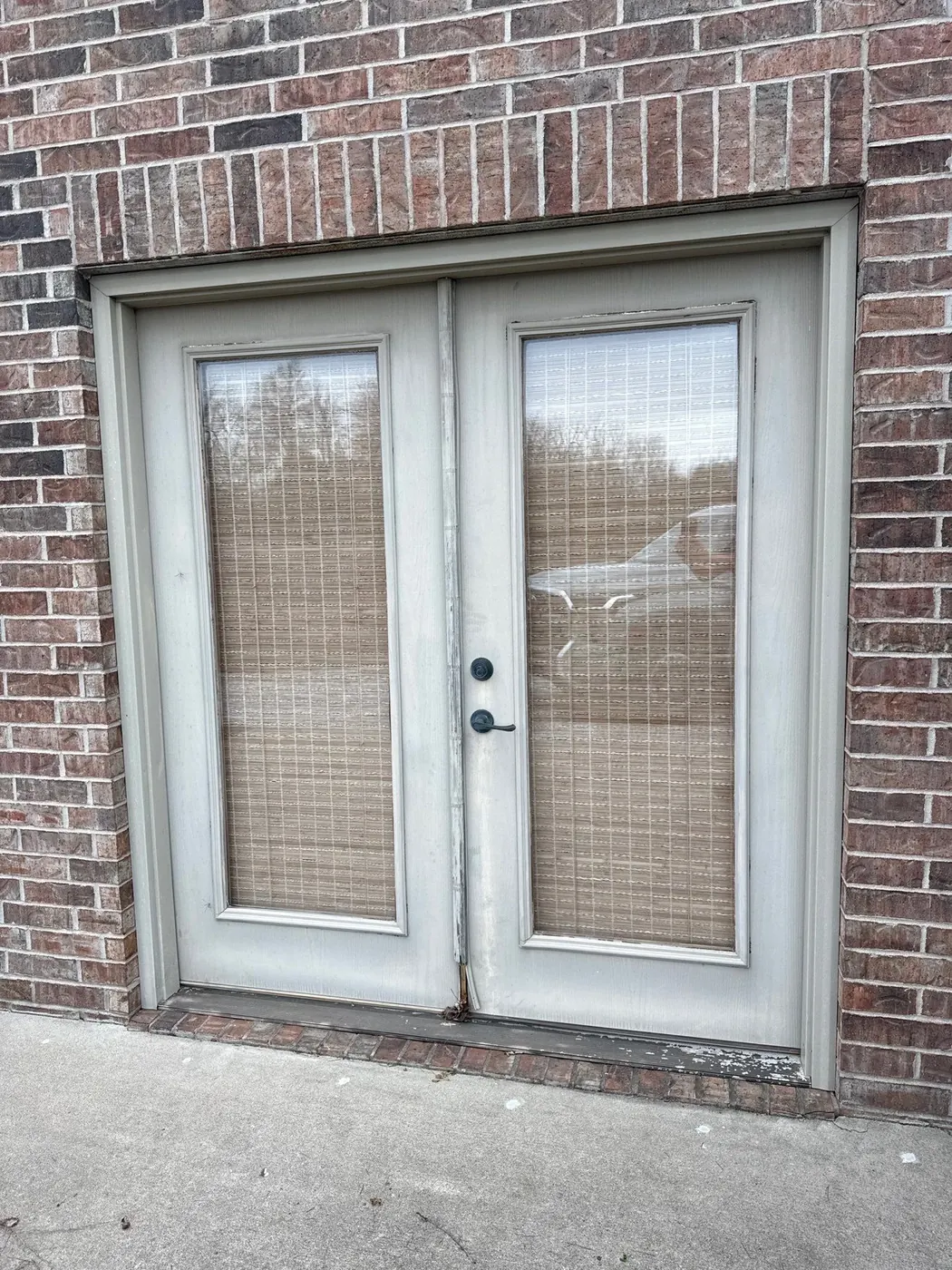 Before: older patio doors can look worn and feel harder to use.